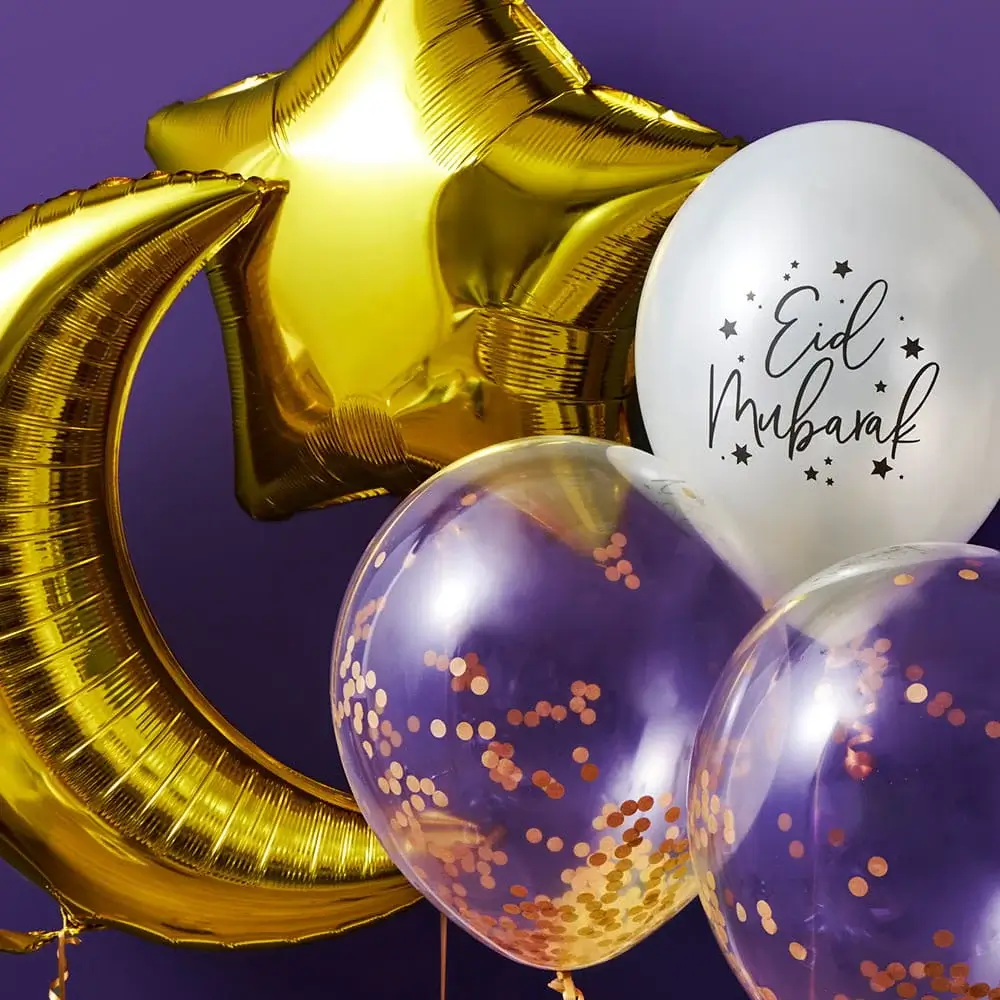 Gold crescent moon and star balloons paired with white and clear confetti balloons featuring an Eid Mubarak design against a purple background.
